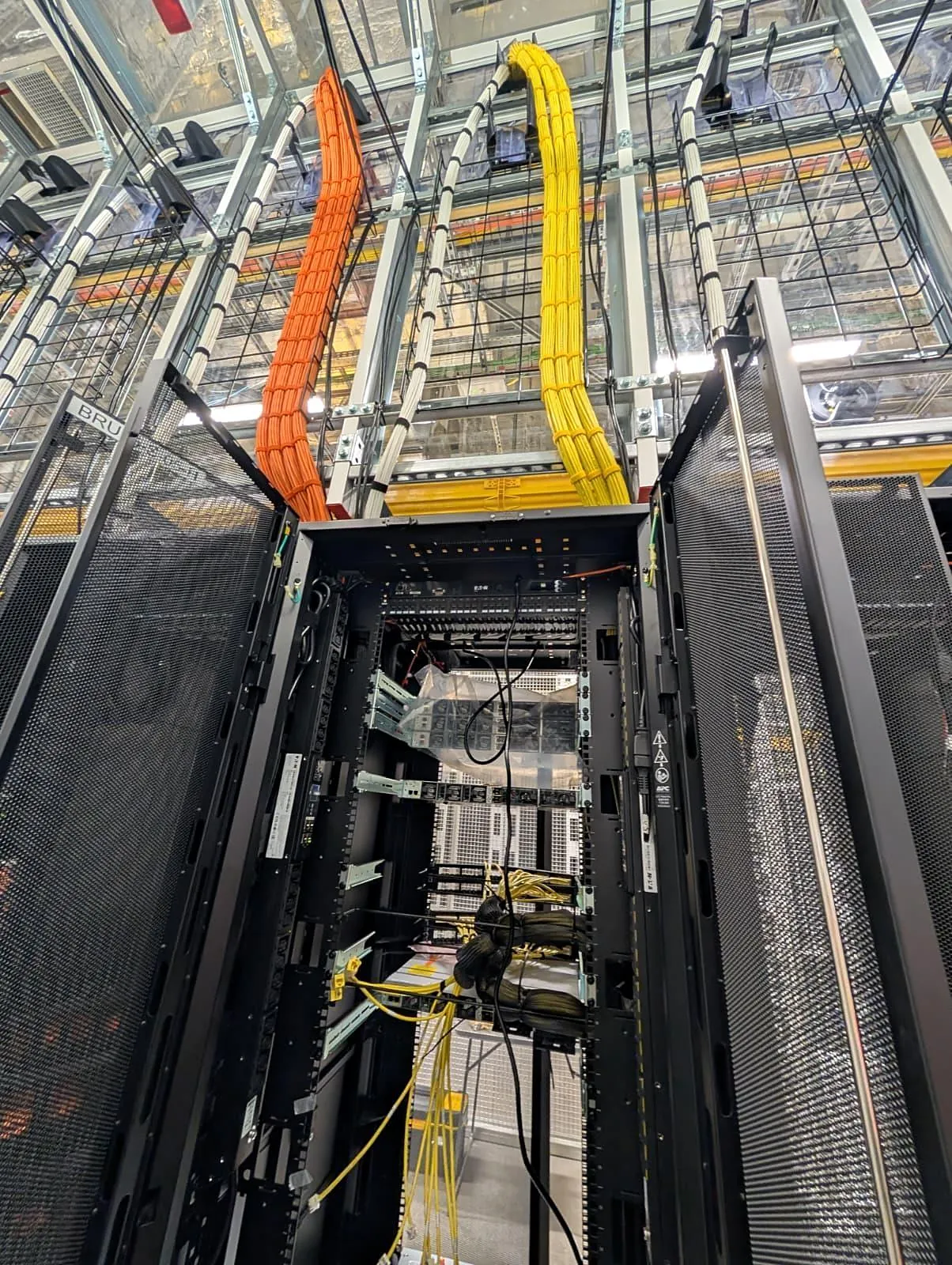 Cable containment above server racks in a data hall
