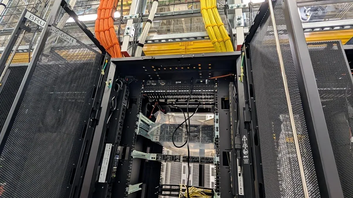 Cable containment above server racks in a data hall