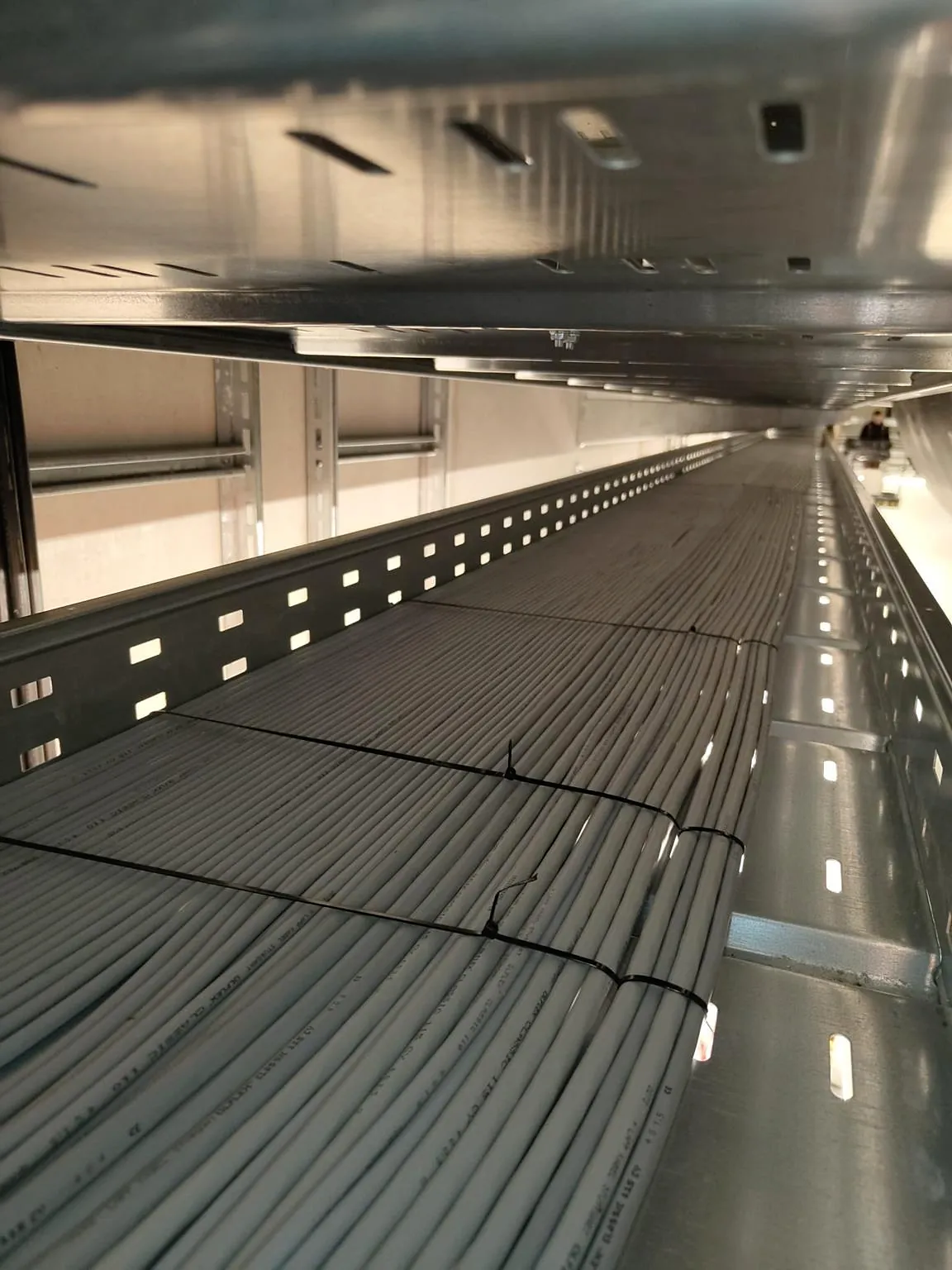 Cable trays with power and data cables on the production floor