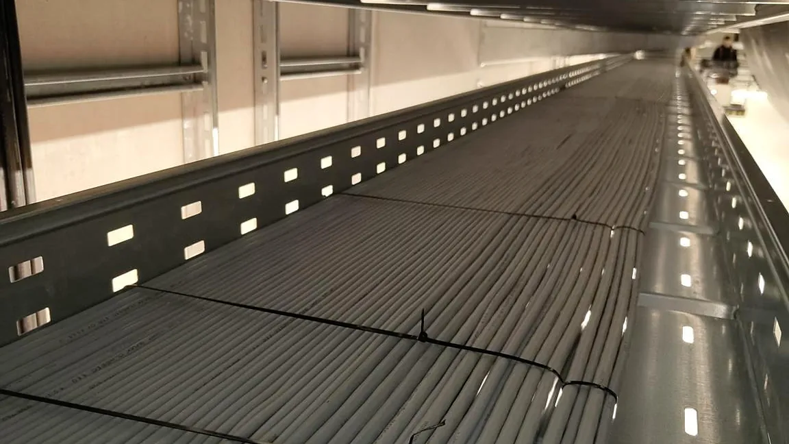 Cable trays with power and data cables on the production floor