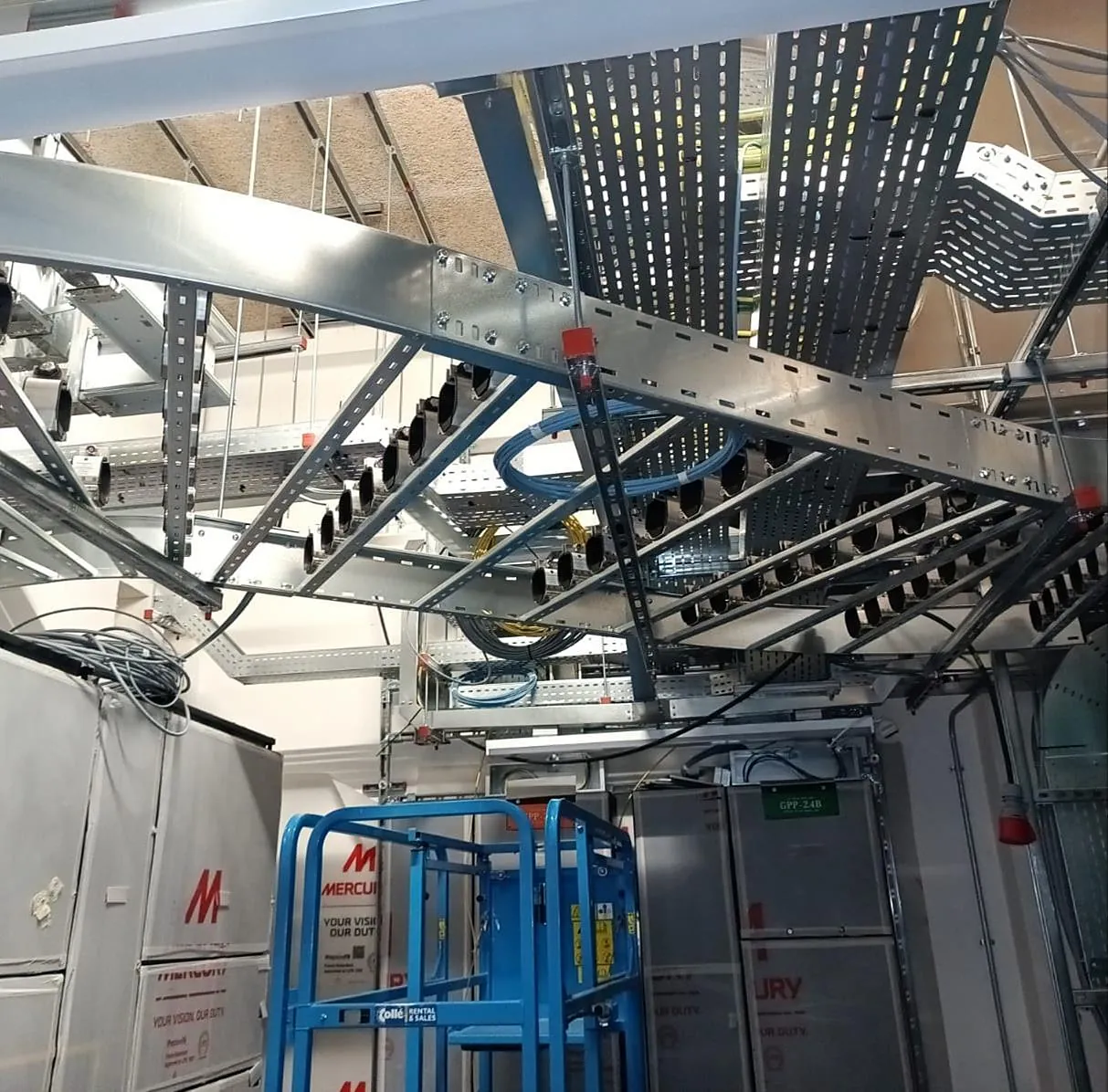 Cable containment above server racks in a data hall