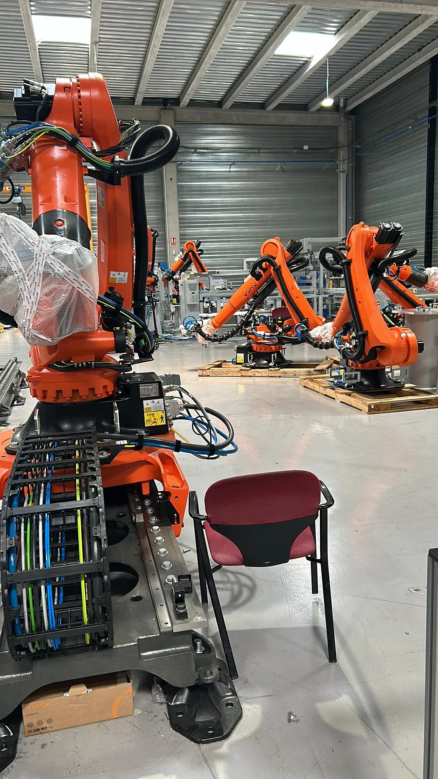 Industrial robots in a robot cell before connection